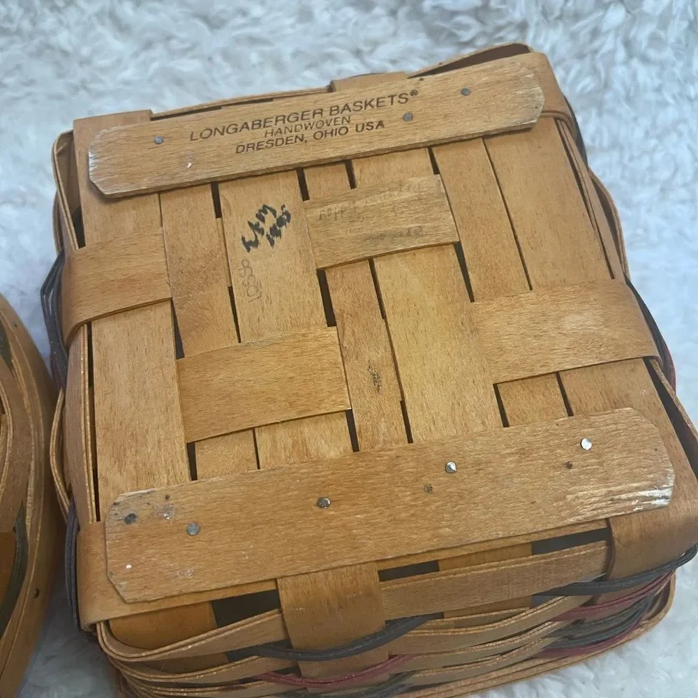 Longaberger 1995 set of two Handcrafted round and Square Woven baskets .